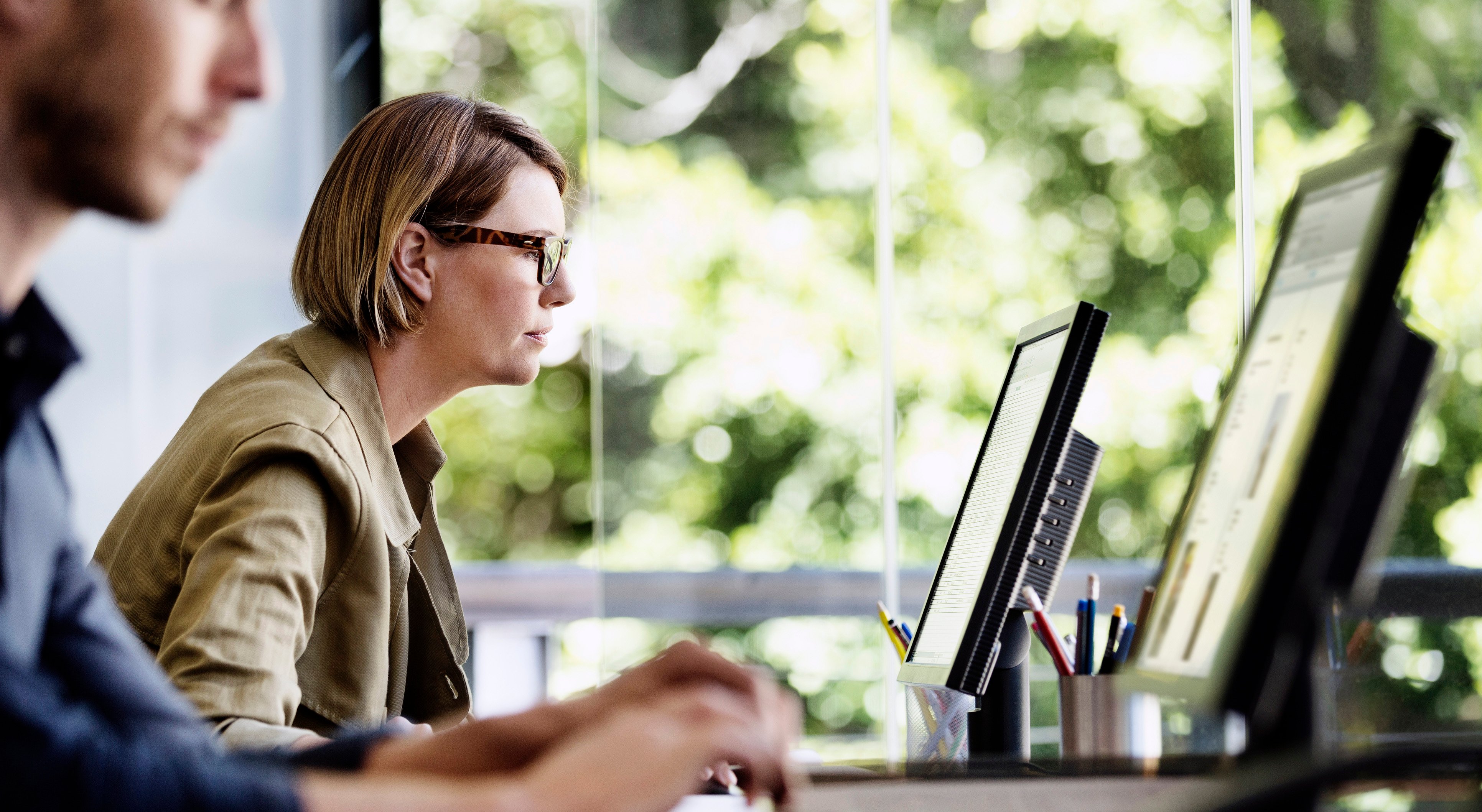 Businesswoman using computer in office-555250289