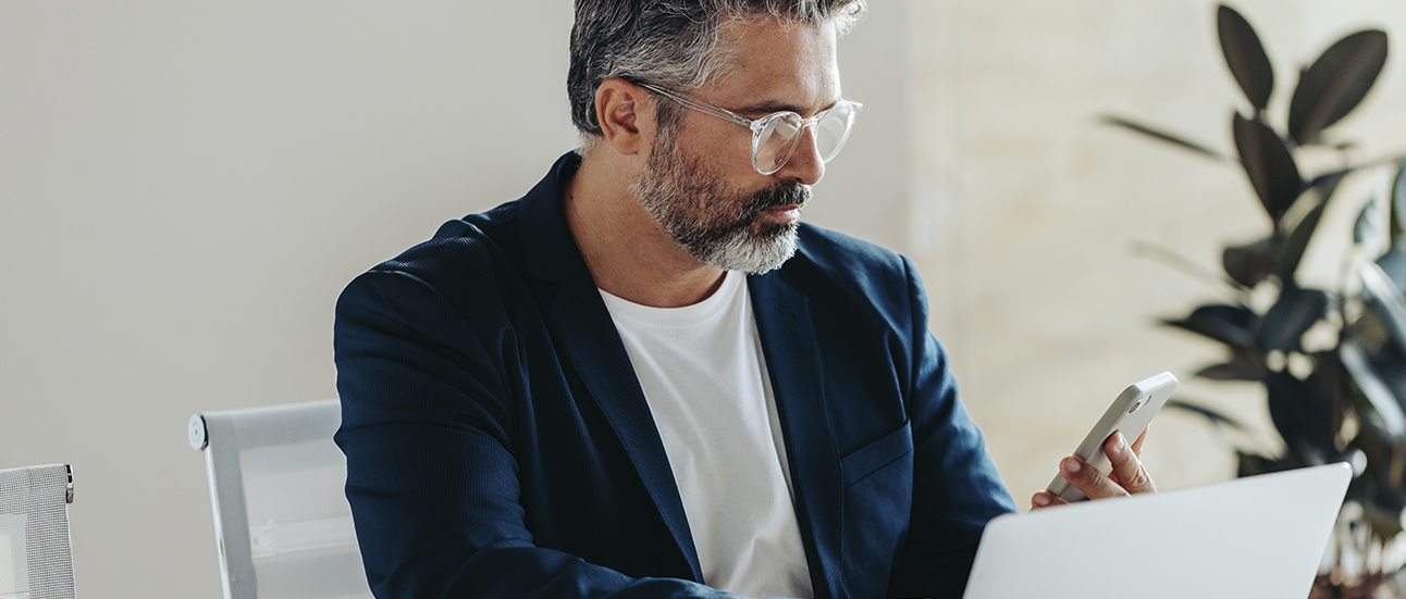 Business man with phone and pc