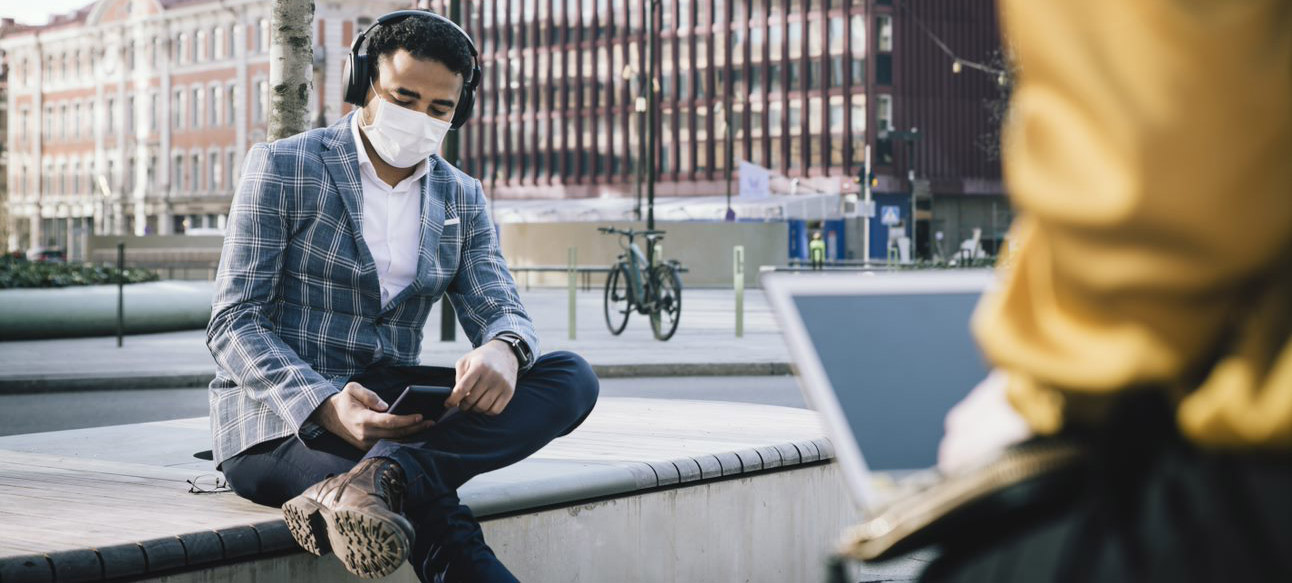 Man with phone and mouth piece