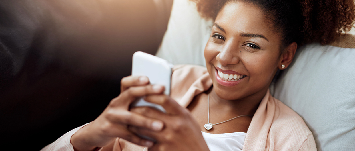 Woman smiling with a phone