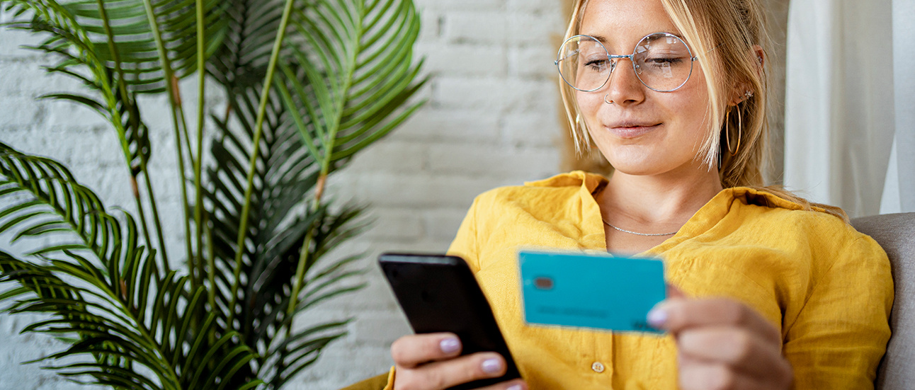 Woman with phone and credit card