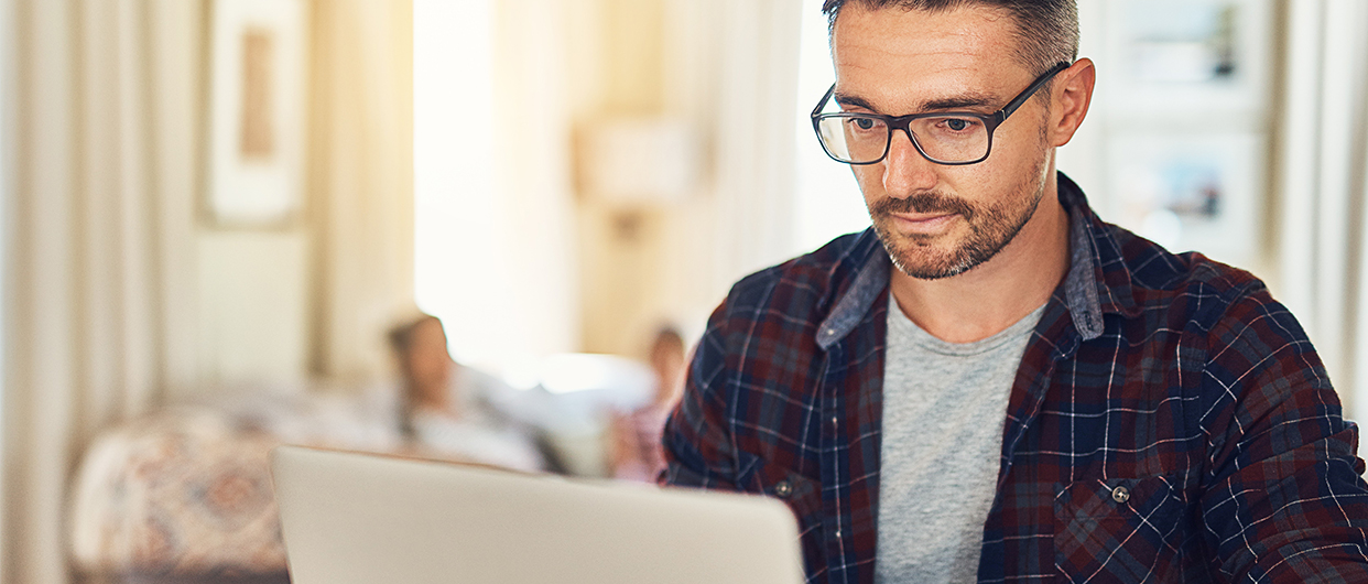 Man looking at his laptop