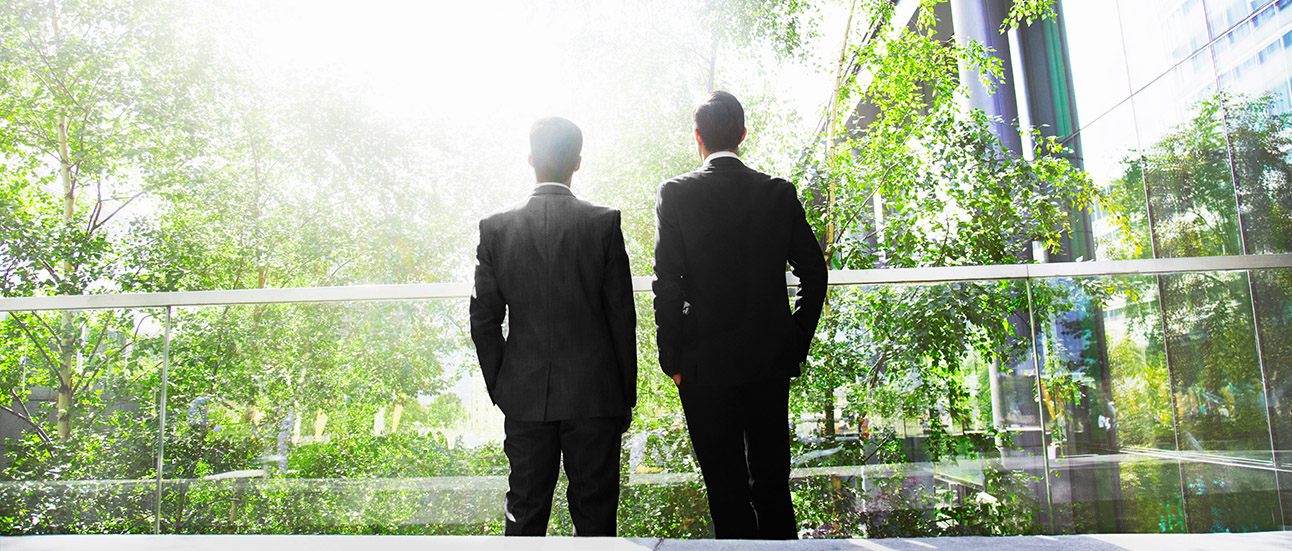 two men in green office