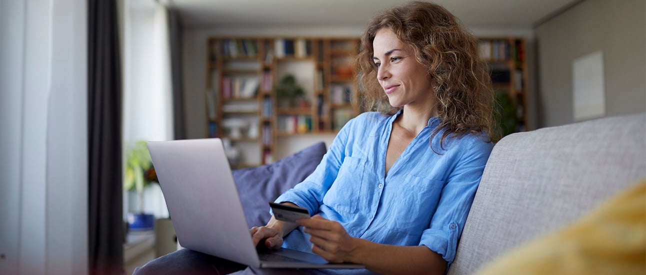 woman in sofa paying